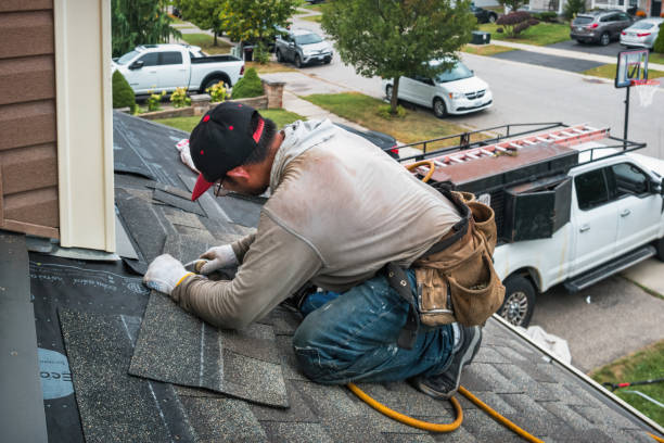 Professional Storm Damage Roof Repair technician working in Alma, MI